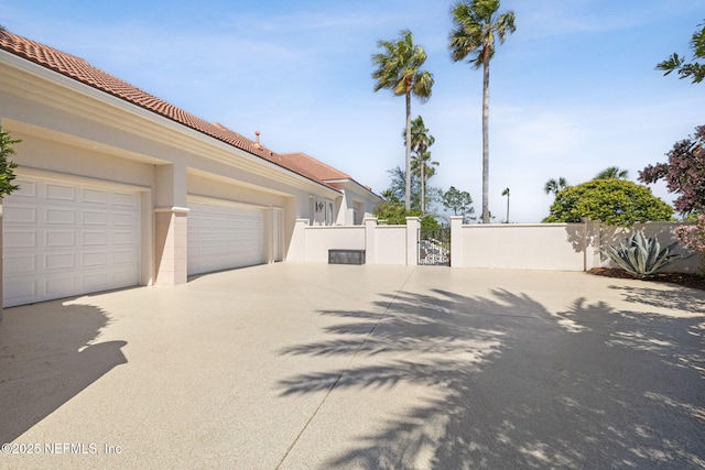 236 Deer Haven Dr, Ponte Vedra Beach, FL 32082 - view of concrete driveway with a gate