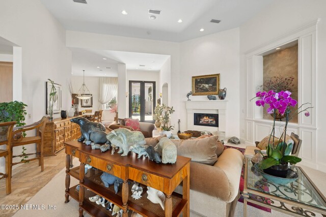 236 Deer Haven Dr, Ponte Vedra Beach, FL 32082 - living room with a glass covered fireplace, recessed lighting, and french doors