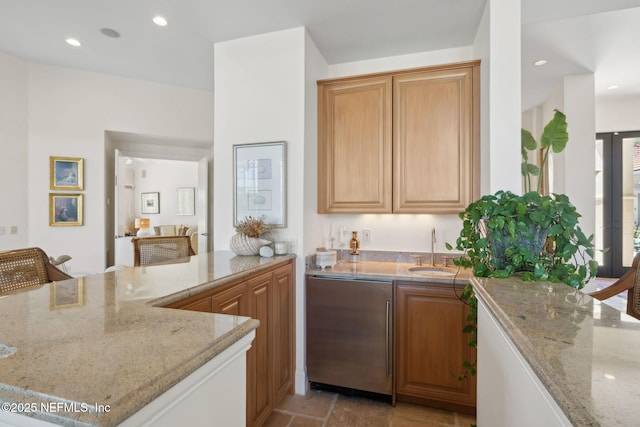 236 Deer Haven Dr, Ponte Vedra Beach, FL 32082 - kitchen with a sink, light stone countertops, refrigerator, a peninsula, and recessed lighting