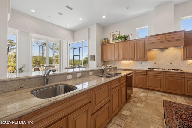 236 Deer Haven Dr, Ponte Vedra Beach, FL 32082 - kitchen with a sink, stainless steel appliances, tasteful backsplash, stone tile floors, and recessed lighting