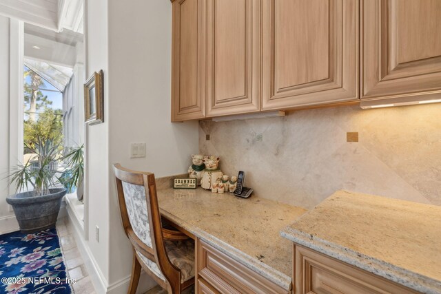 236 Deer Haven Dr, Ponte Vedra Beach, FL 32082 - kitchen featuring decorative backsplash, light stone counters, baseboards, and light brown cabinets