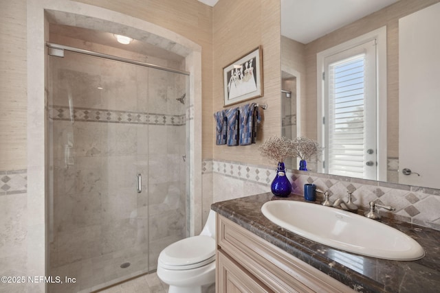 236 Deer Haven Dr, Ponte Vedra Beach, FL 32082 - full bathroom with a stall shower, vanity, toilet, and tile walls