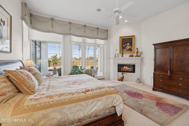 236 Deer Haven Dr, Ponte Vedra Beach, FL 32082 - bedroom featuring a fireplace with flush hearth, light carpet, recessed lighting, and a ceiling fan