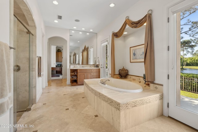 236 Deer Haven Dr, Ponte Vedra Beach, FL 32082 - bathroom with vanity, a garden tub, a stall shower, and recessed lighting