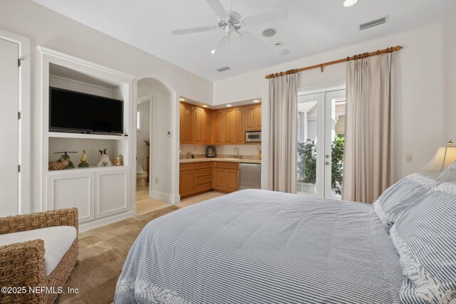 236 Deer Haven Dr, Ponte Vedra Beach, FL 32082 - bedroom featuring a sink, access to exterior, ensuite bathroom, arched walkways, and a ceiling fan