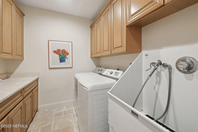 236 Deer Haven Dr, Ponte Vedra Beach, FL 32082 - laundry room with washer and dryer, baseboards, cabinet space, and light stone finish flooring