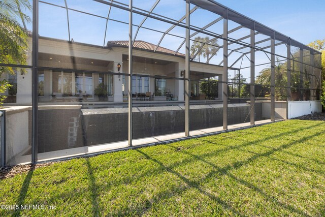 236 Deer Haven Dr, Ponte Vedra Beach, FL 32082 - back of house featuring a lawn, a lanai, and a tiled roof