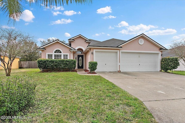 ranch-style home with stucco siding, an attached garage, fence, driveway, and a front lawn