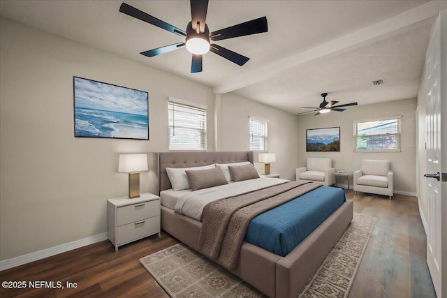 bedroom featuring ceiling fan, wood finished floors, visible vents, and baseboards