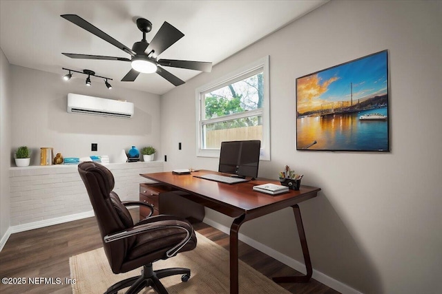 home office with a ceiling fan, baseboards, wood finished floors, and a wall mounted air conditioner