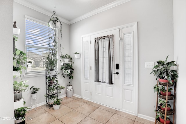 entrance foyer with light tile patterned floors, baseboards, and crown molding