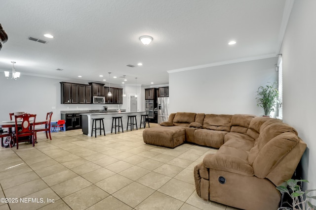 living room with visible vents, crown molding, a chandelier, light tile patterned floors, and recessed lighting