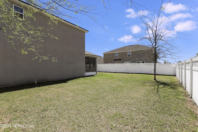view of yard featuring a fenced backyard