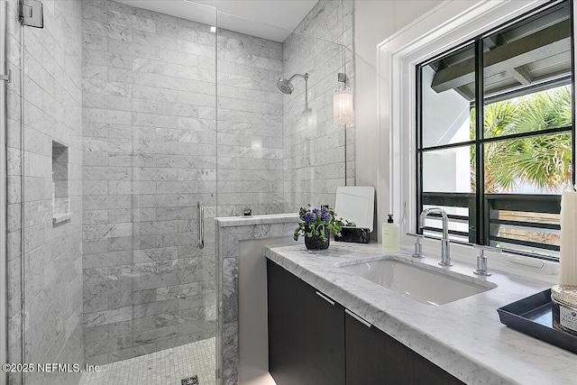 full bath featuring a stall shower and vanity