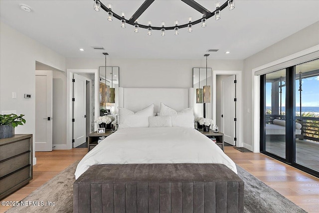 bedroom featuring recessed lighting, visible vents, baseboards, light wood-style floors, and access to exterior