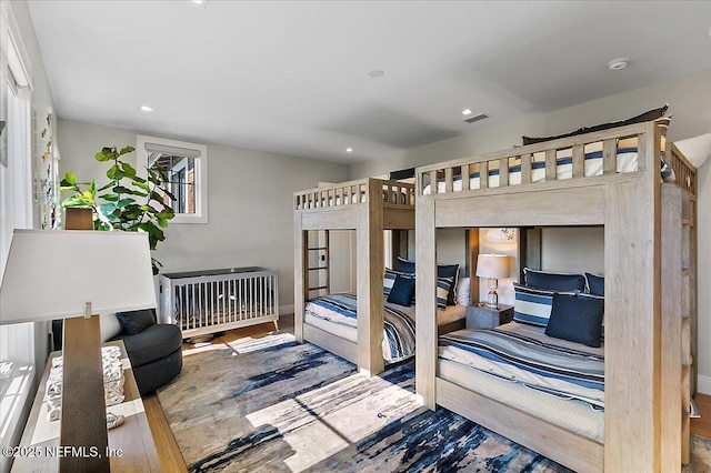 bedroom featuring visible vents, wood finished floors, and recessed lighting