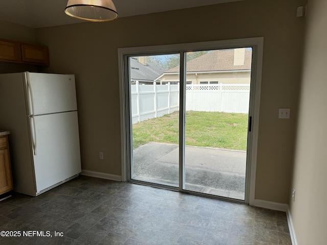 entryway featuring baseboards