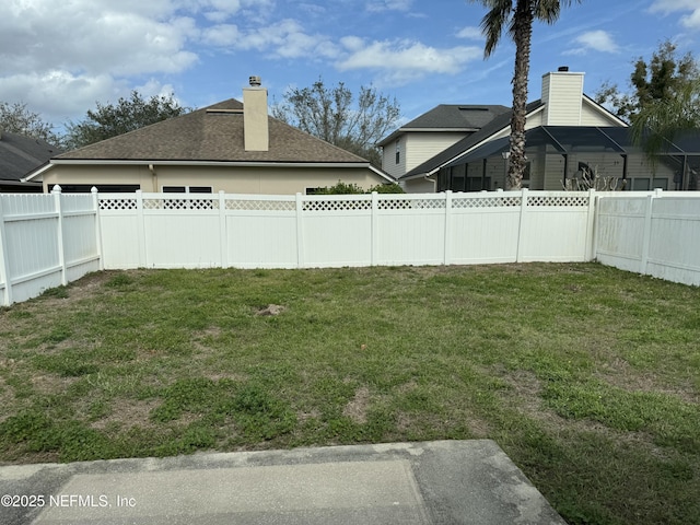 view of yard featuring a fenced backyard