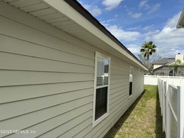 view of home's exterior featuring fence