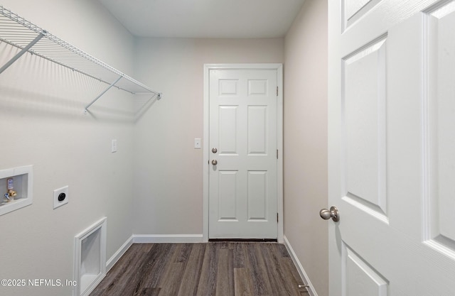 clothes washing area featuring laundry area, baseboards, dark wood-type flooring, hookup for an electric dryer, and washer hookup