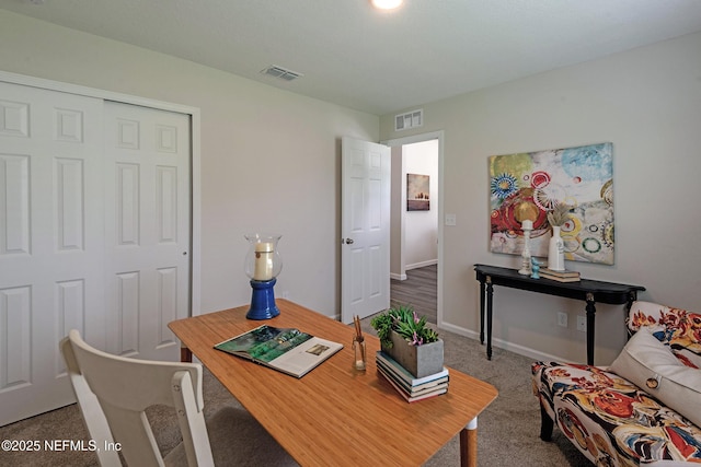 home office with carpet floors, baseboards, and visible vents