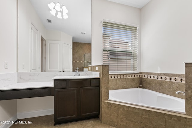 full bathroom featuring a garden tub, visible vents, tiled shower, and vanity