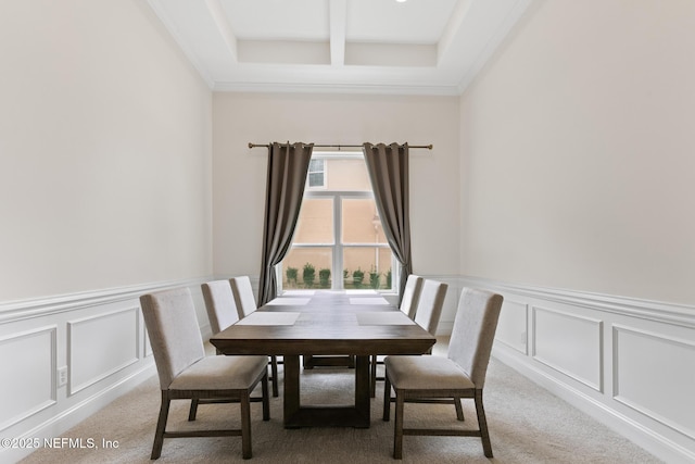 dining space with coffered ceiling, light colored carpet, a decorative wall, and beamed ceiling