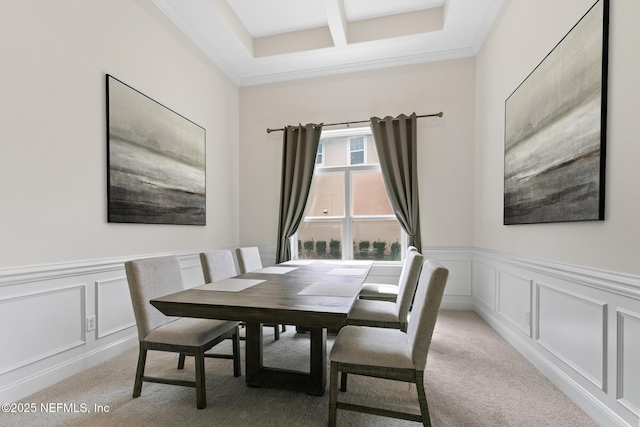 dining area with a decorative wall, beamed ceiling, coffered ceiling, and light colored carpet