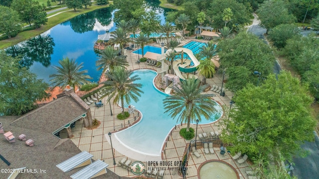 birds eye view of property with a water view