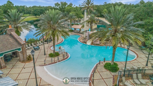 community pool featuring a water slide