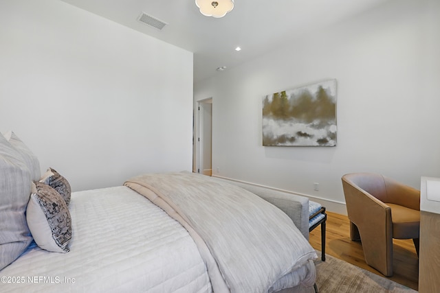 bedroom featuring recessed lighting, visible vents, and wood finished floors