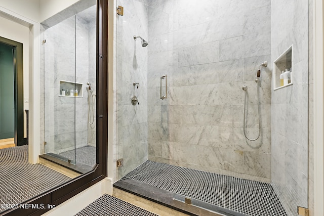 bathroom with a shower stall