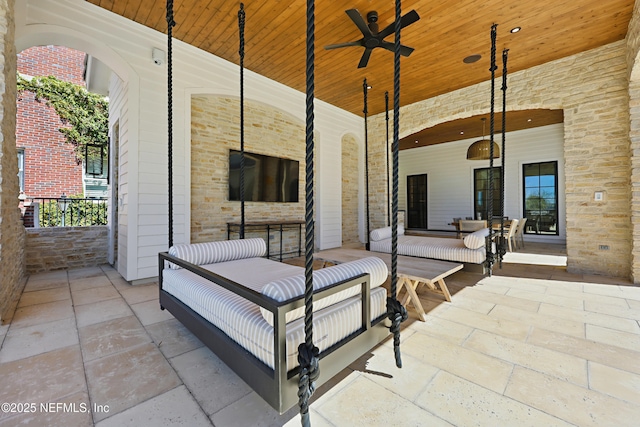 view of patio / terrace with a ceiling fan and covered porch