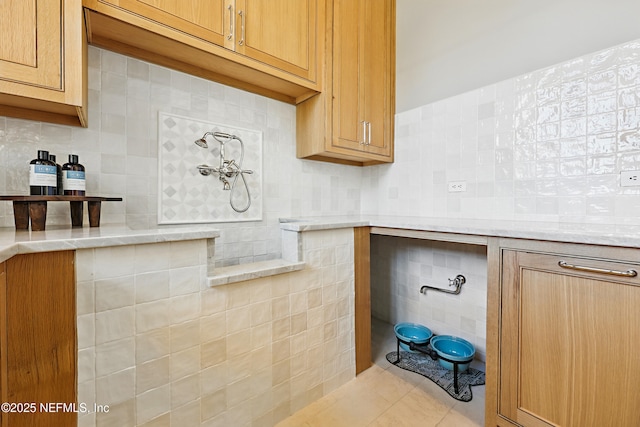 bathroom with tile walls, backsplash, and tile patterned floors