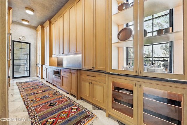 interior space featuring marble finish floor and dark countertops