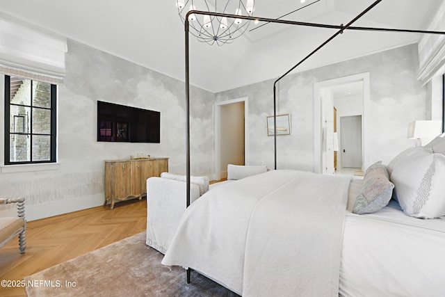 bedroom with baseboards and a chandelier