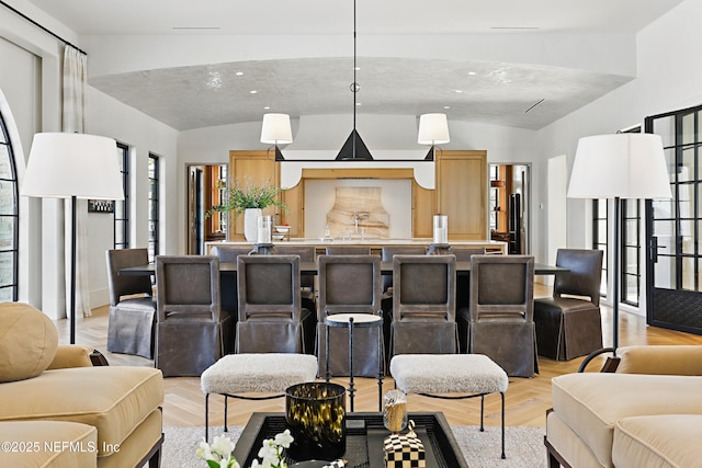 interior space featuring vaulted ceiling and light wood finished floors