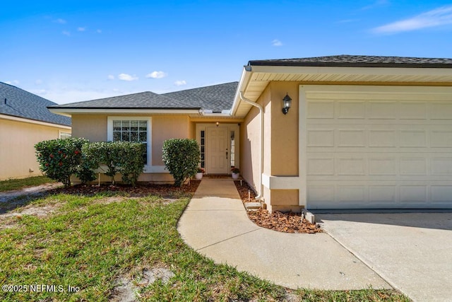 view of front of home with a garage, driveway, a shingled roof, and stucco siding