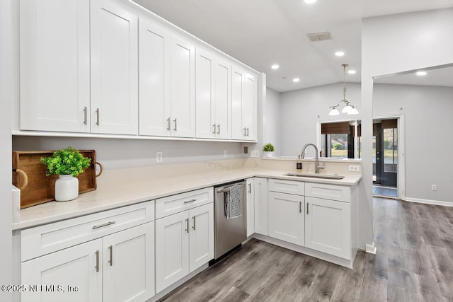 kitchen with light wood finished floors, recessed lighting, white cabinets, a sink, and dishwasher