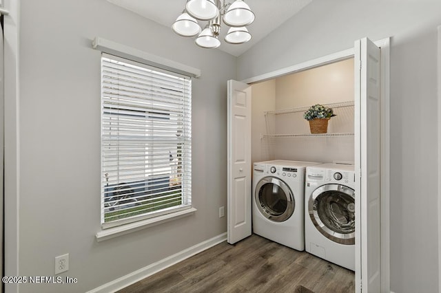 laundry room featuring a chandelier, laundry area, separate washer and dryer, baseboards, and dark wood-style floors