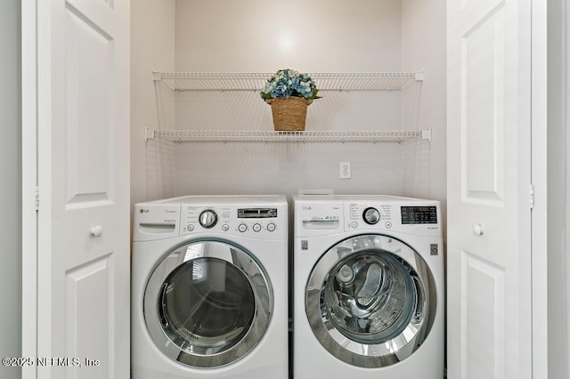 washroom with laundry area and washing machine and clothes dryer