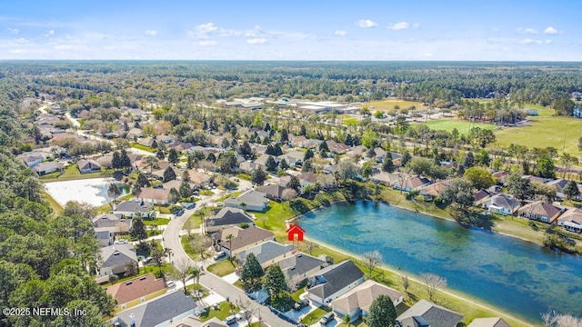 bird's eye view featuring a residential view and a water view