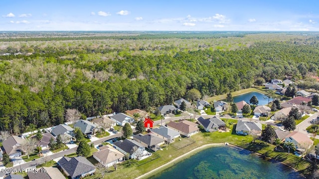 bird's eye view featuring a water view, a residential view, and a view of trees