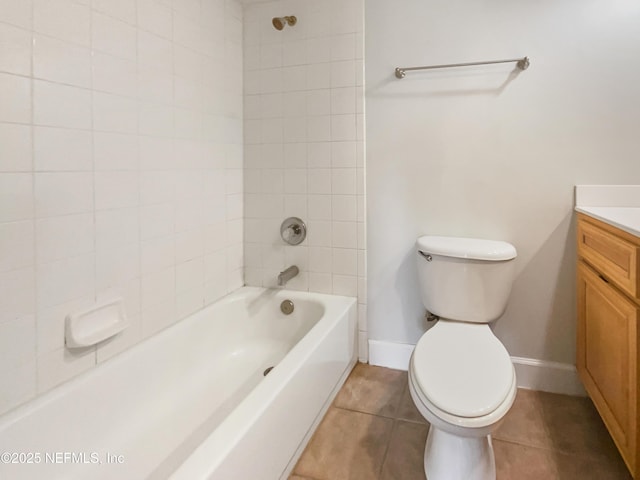 full bathroom featuring tile patterned flooring, toilet, vanity, baseboards, and shower / bathing tub combination