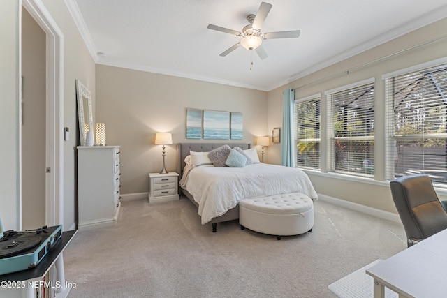 bedroom featuring light colored carpet, baseboards, and ornamental molding