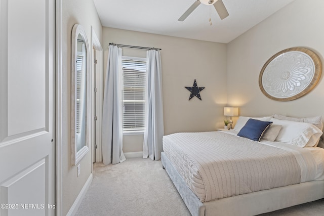 bedroom featuring carpet flooring, a ceiling fan, and baseboards