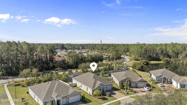 birds eye view of property with a residential view and a view of trees