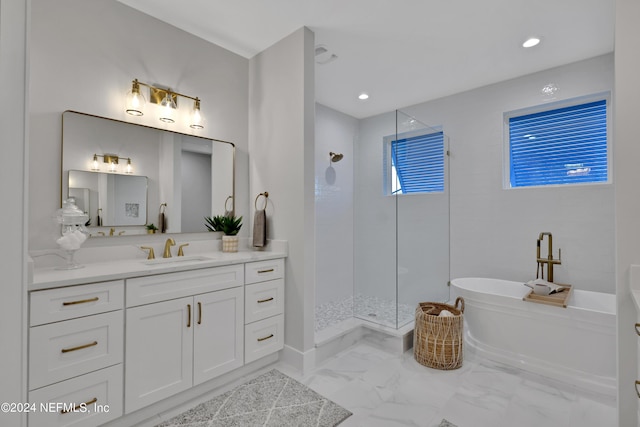 bathroom featuring a soaking tub, a shower stall, vanity, and marble finish floor