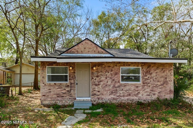 view of front of home featuring brick siding