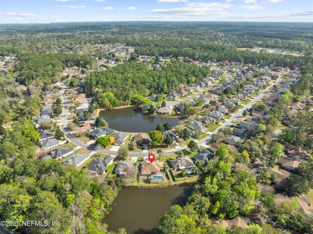 bird's eye view with a water view, a residential view, and a wooded view